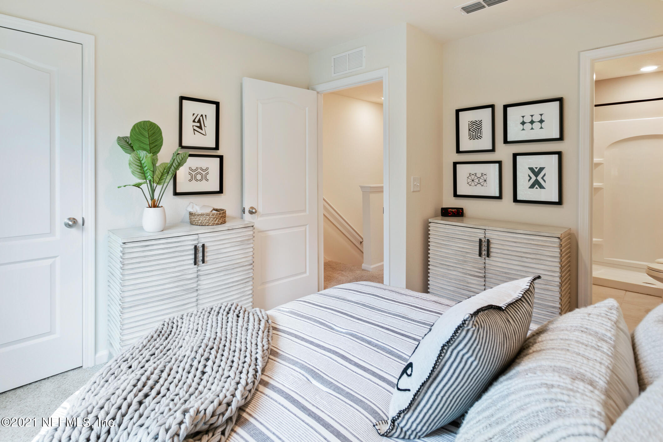 3972 Oak Mill Road Orange Park, FL 32065 - Photo 21 of 24 a bedroom with a bed and painting on the wall
