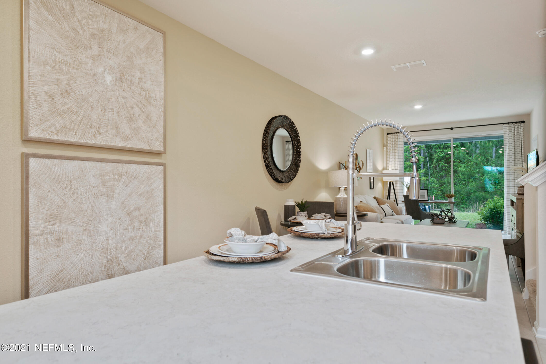 3972 Oak Mill Road Orange Park, FL 32065 - Photo 7 of 24 a kitchen with a sink and a refrigerator