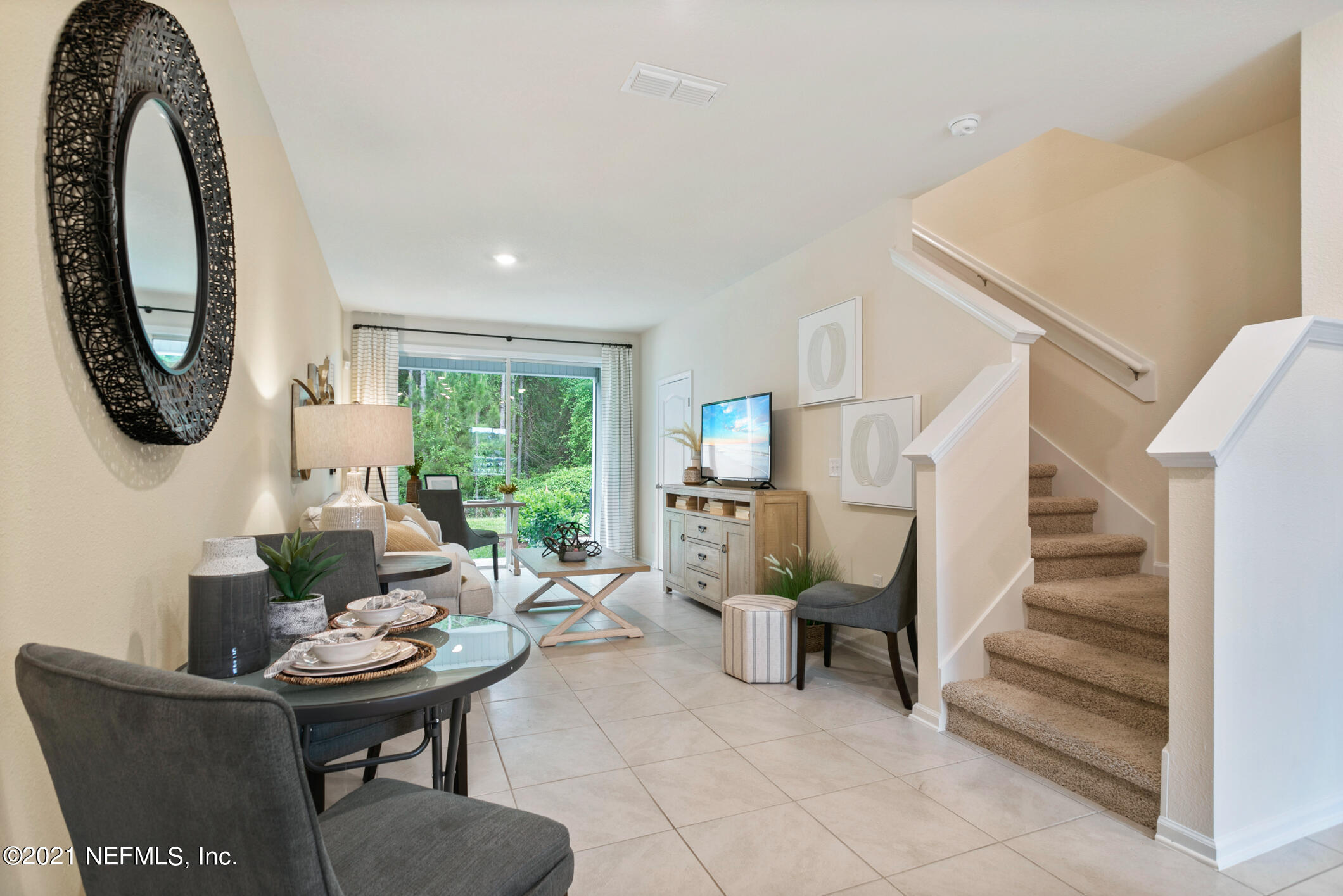 3972 Oak Mill Road Orange Park, FL 32065 - Photo 8 of 24 a living room with furniture a window and a table