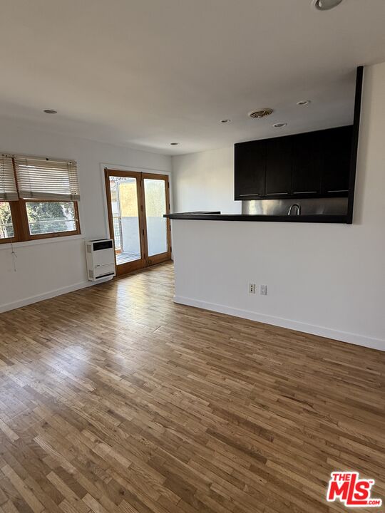 250 3rd Avenue Venice, CA 90291 - Photo 5 of 20 a view of an empty room with window and wooden floor
