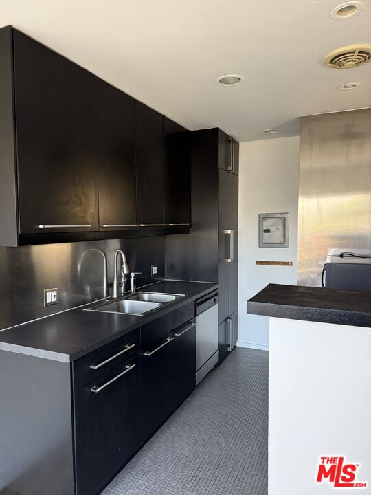 250 3rd Avenue Venice, CA 90291 - Photo 8 of 20 a kitchen with stainless steel appliances granite countertop a sink and a stove