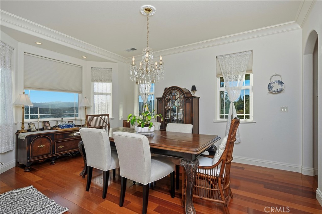 18750 Fernwood Road Hidden Valley Lake, CA 95467 - Photo 18 of 53 a view of a dining room with furniture window and wooden floor