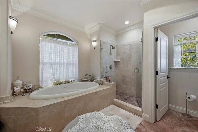 a living room with furniture a flat screen tv and a large window