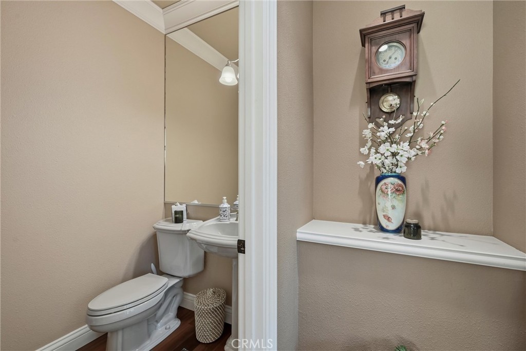 18750 Fernwood Road Hidden Valley Lake, CA 95467 - Photo 35 of 53 a bathroom with a toilet a sink and mirror