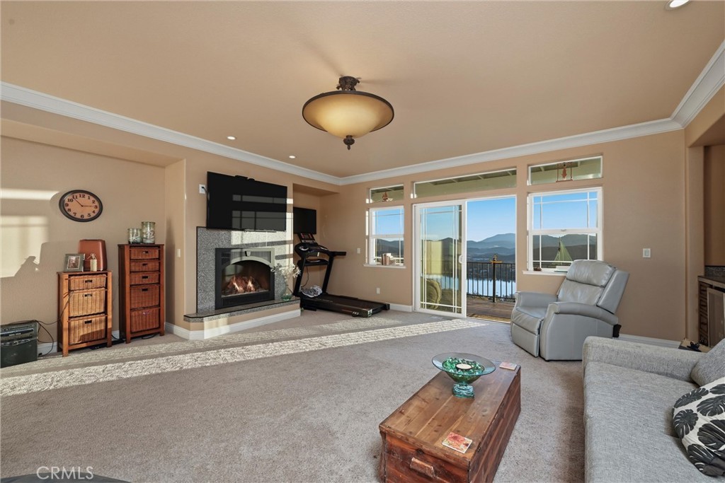 18750 Fernwood Road Hidden Valley Lake, CA 95467 - Photo 37 of 53 a living room with furniture a flat screen tv and a large window
