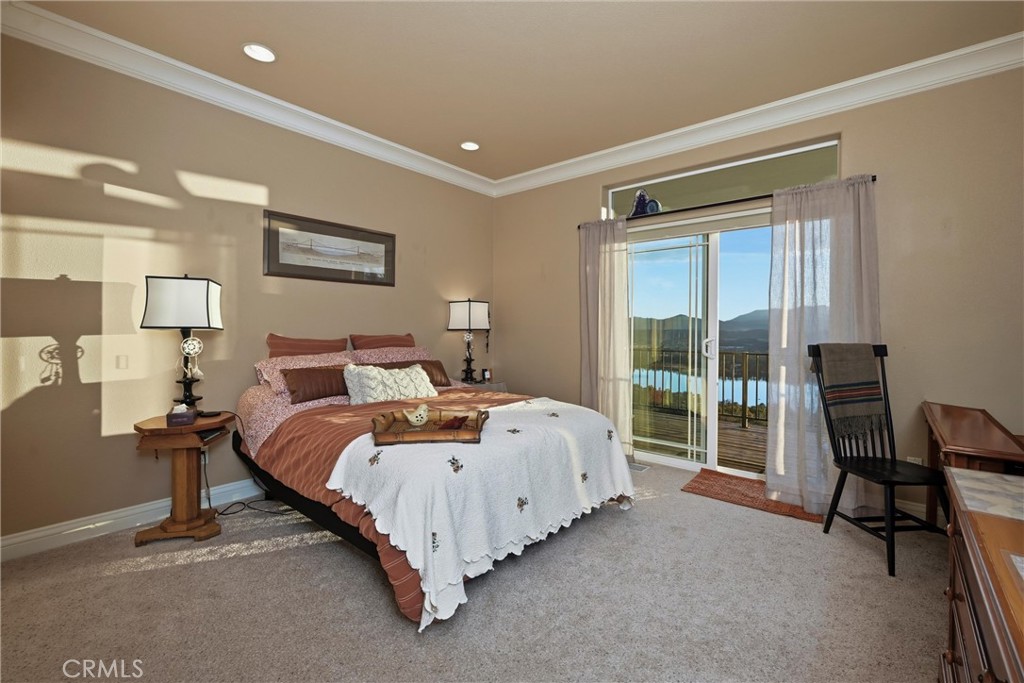 18750 Fernwood Road Hidden Valley Lake, CA 95467 - Photo 39 of 53 a spacious bedroom with a bed and a large window