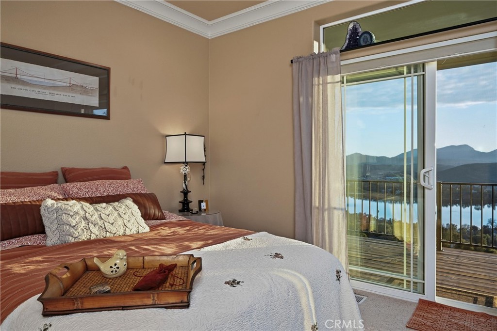 18750 Fernwood Road Hidden Valley Lake, CA 95467 - Photo 40 of 53 a bedroom with a large bed and a window