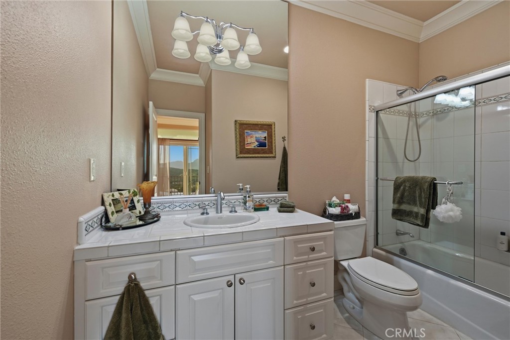 18750 Fernwood Road Hidden Valley Lake, CA 95467 - Photo 41 of 53 a bathroom with a toilet a sink and mirror