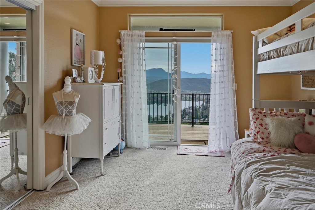 18750 Fernwood Road Hidden Valley Lake, CA 95467 - Photo 42 of 53 a bed room with a bed and a mirror