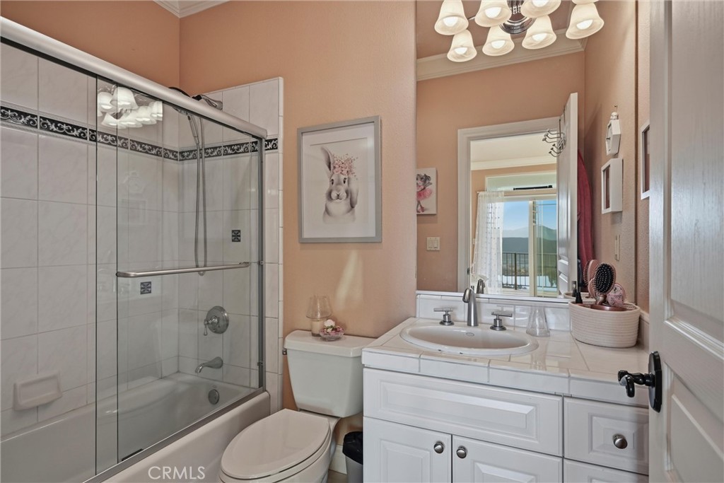 18750 Fernwood Road Hidden Valley Lake, CA 95467 - Photo 43 of 53 a bathroom with a sink a toilet a mirror and shower