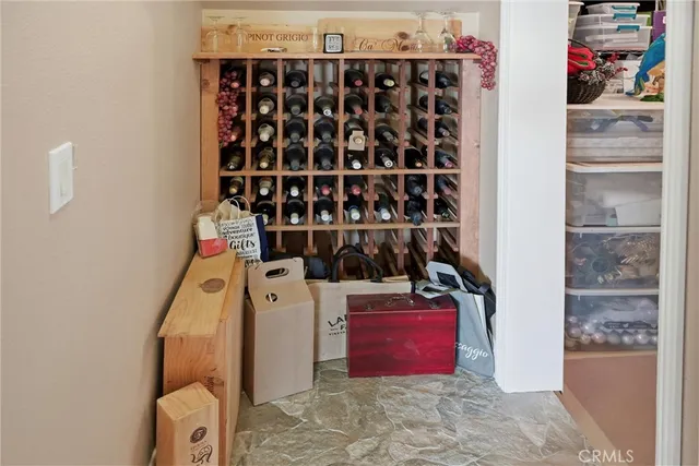 a view of a balcony with chair and wooden floor