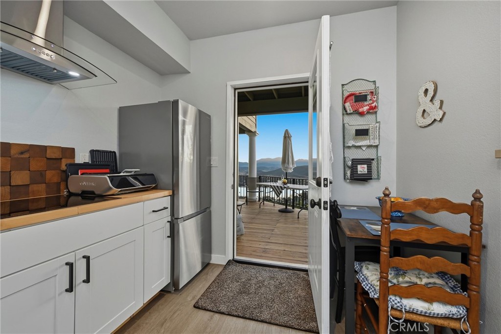 18750 Fernwood Road Hidden Valley Lake, CA 95467 - Photo 48 of 53 a kitchen with stainless steel appliances granite countertop a refrigerator and a sink