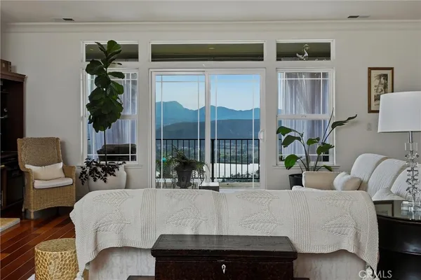 a living room with furniture fireplace and flat screen tv