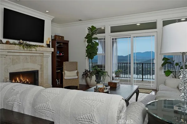 a balcony with furniture and potted plants