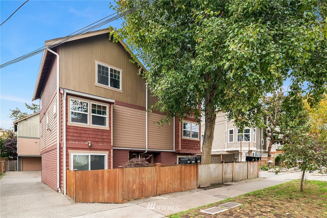 723 North 95th Street, Unit B Seattle, WA 98103 - Photo 1 of 24 a front view of a house with a yard