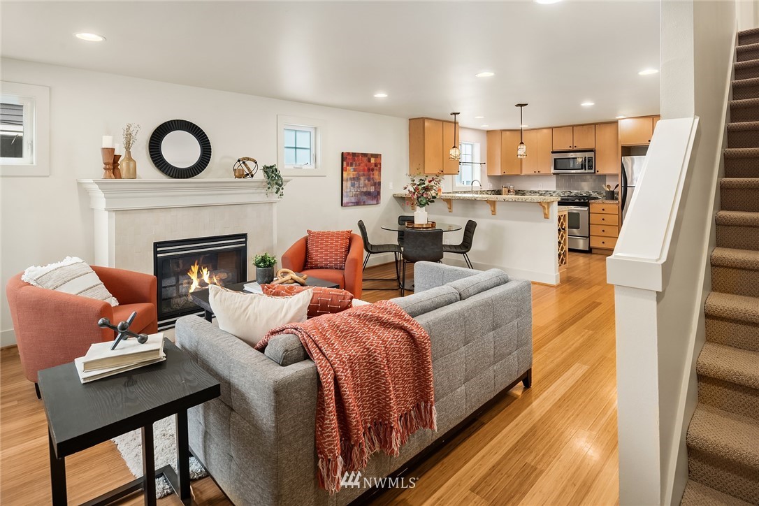 723 North 95th Street, Unit B Seattle, WA 98103 - Photo 11 of 24 a living room with furniture and a fireplace