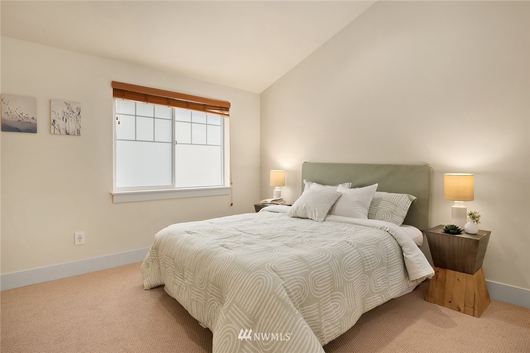 723 North 95th Street, Unit B Seattle, WA 98103 - Photo 15 of 24 a bedroom with a bed and window