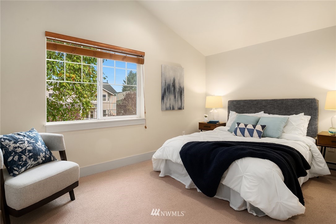 723 North 95th Street, Unit B Seattle, WA 98103 - Photo 17 of 24 a bedroom with bed and a window with outer view