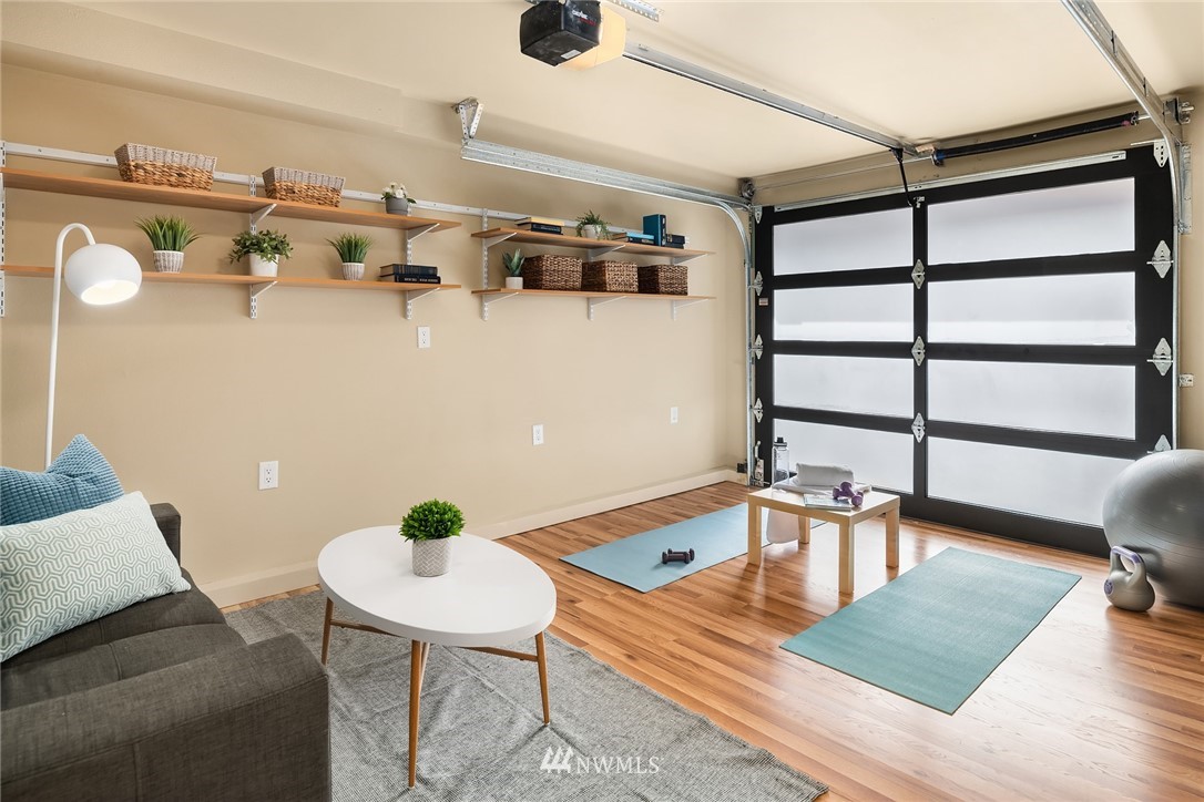 723 North 95th Street, Unit B Seattle, WA 98103 - Photo 22 of 24 a view of a dining room with furniture and wooden floor