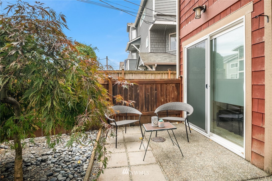 723 North 95th Street, Unit B Seattle, WA 98103 - Photo 23 of 24 a balcony with chairs and with an outdoor space