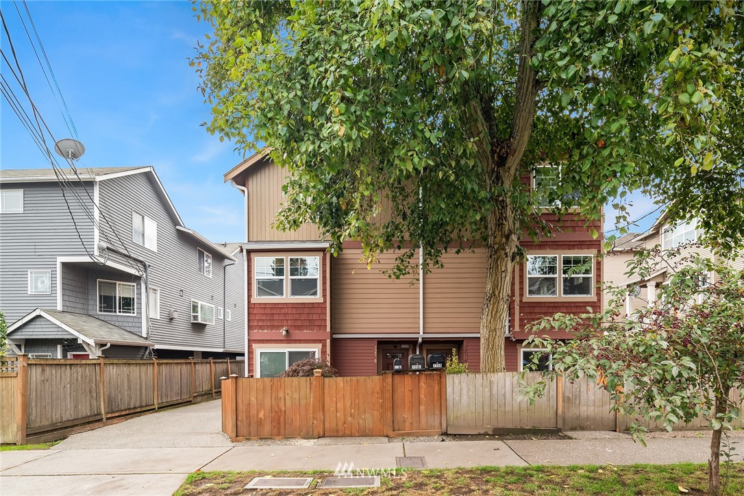 723 North 95th Street, Unit B Seattle, WA 98103 - Photo 24 of 24 a front view of a house with a yard