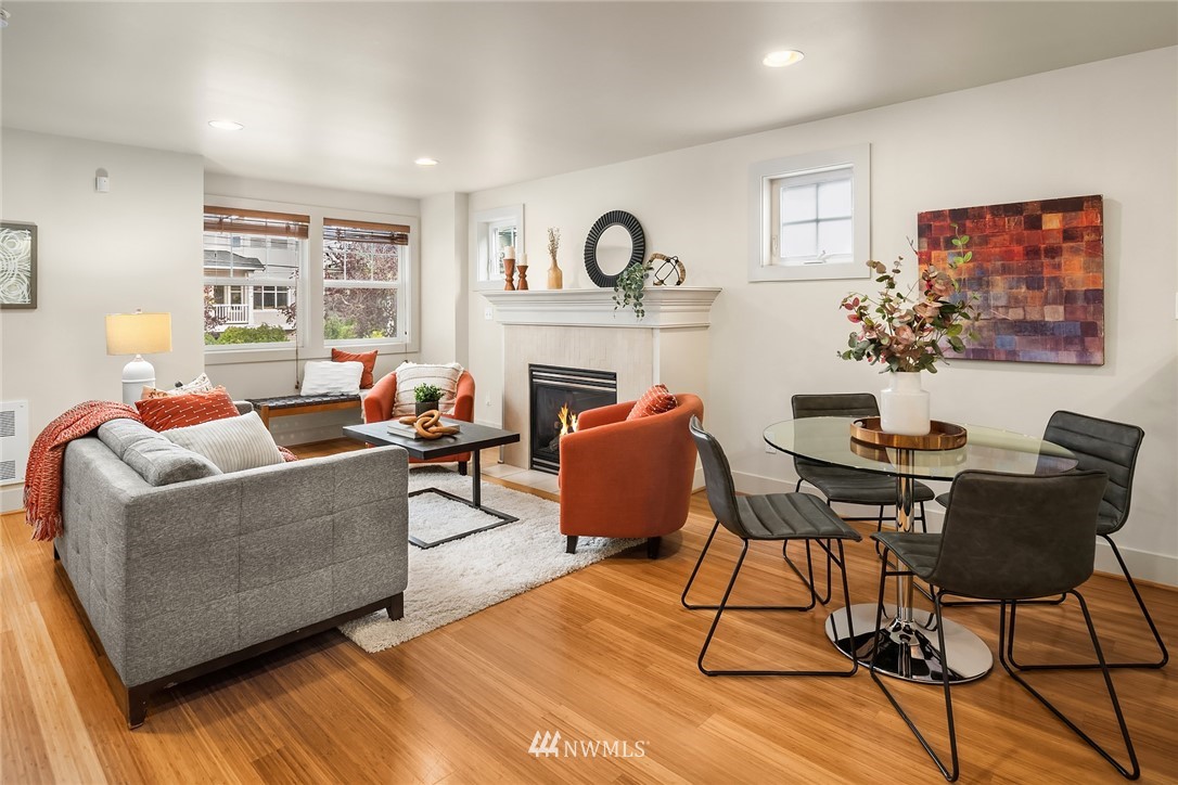 723 North 95th Street, Unit B Seattle, WA 98103 - Photo 5 of 24 a living room with furniture and a fireplace
