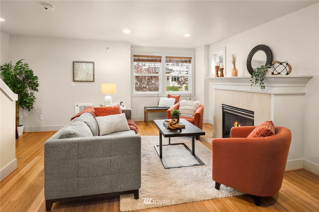 723 North 95th Street, Unit B Seattle, WA 98103 - Photo 8 of 24 a living room with furniture and a fireplace