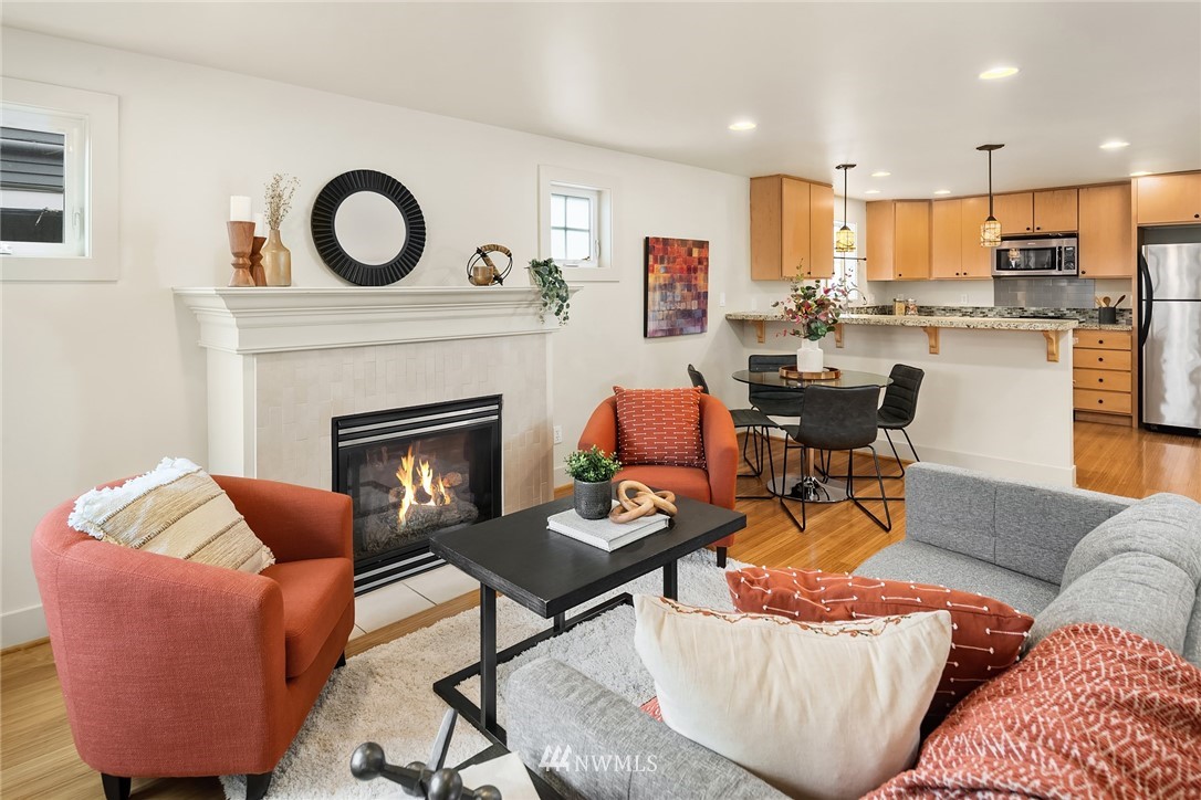 723 North 95th Street, Unit B Seattle, WA 98103 - Photo 9 of 24 a living room with furniture and a fireplace