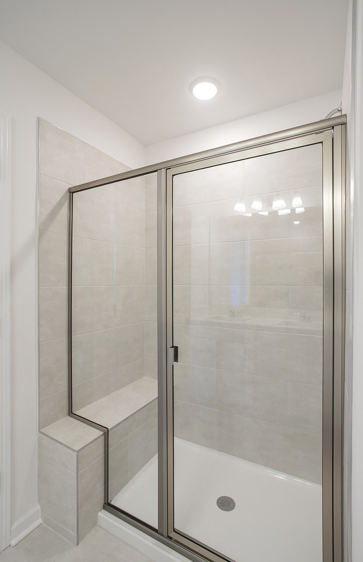7116 Mapleside Lane Fairview, TN 37062 - Photo 14 of 49 a bathroom with a glass shower door