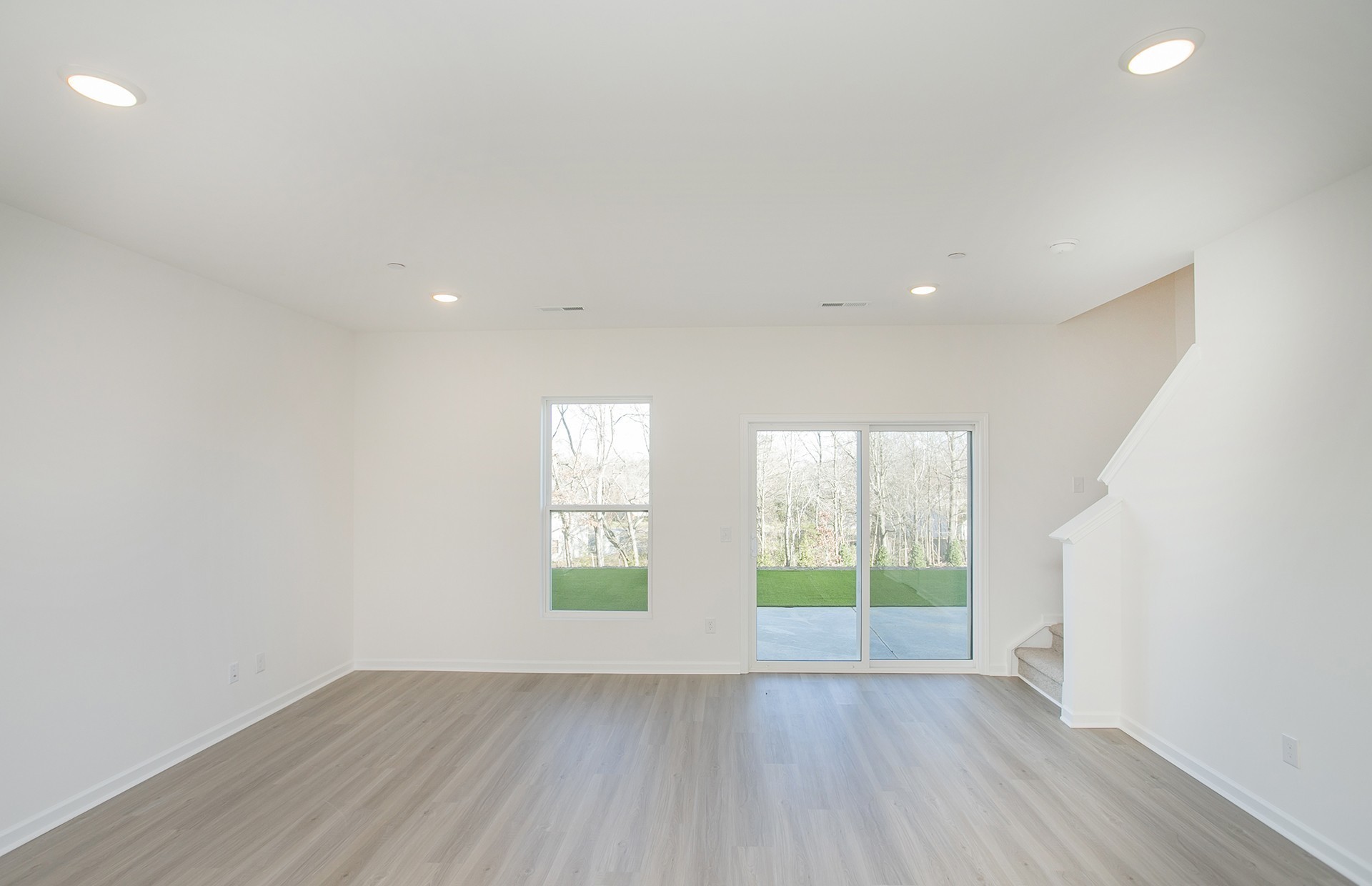 7116 Mapleside Lane Fairview, TN 37062 - Photo 10 of 49 an empty room with wooden floor and windows