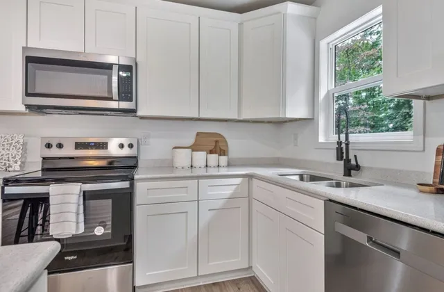 a bedroom with a bed and chair