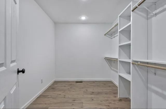 a view of a wooden deck with a yard