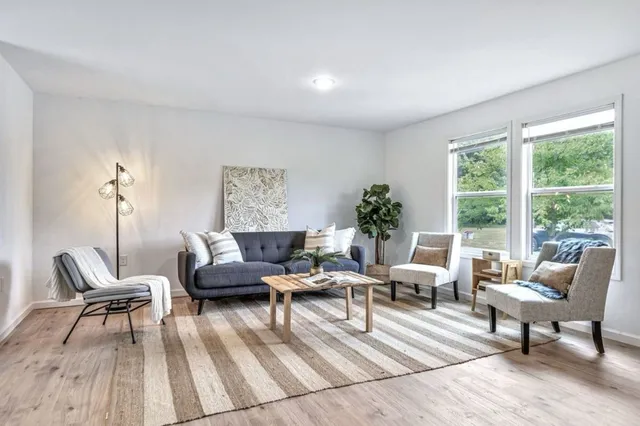 a living room with furniture and a table
