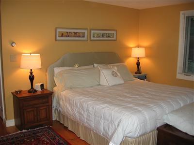 263 Service Road East Sandwich, MA 02537 - Photo 6 of 13 a bedroom with a bed and wooden floor
