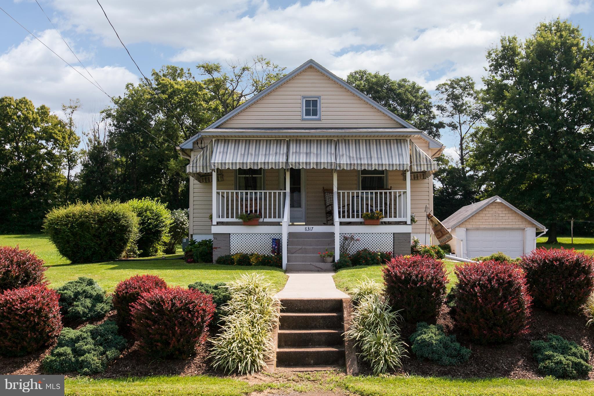 8317 Myersville Road Middletown, MD 21769 - Photo 1 of 30 a front view of a house with a garden