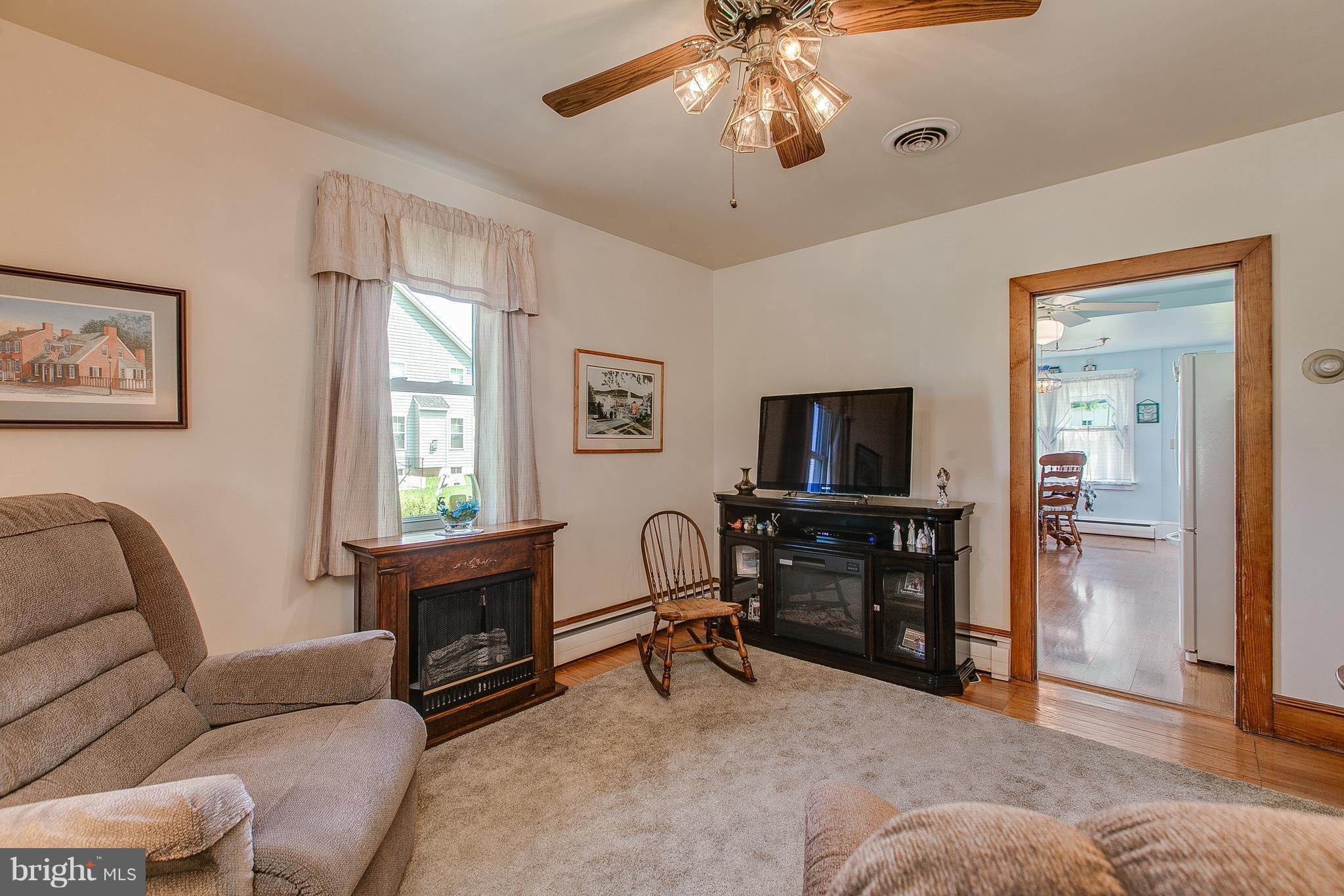 8317 Myersville Road Middletown, MD 21769 - Photo 14 of 30 a living room with furniture and a flat screen tv