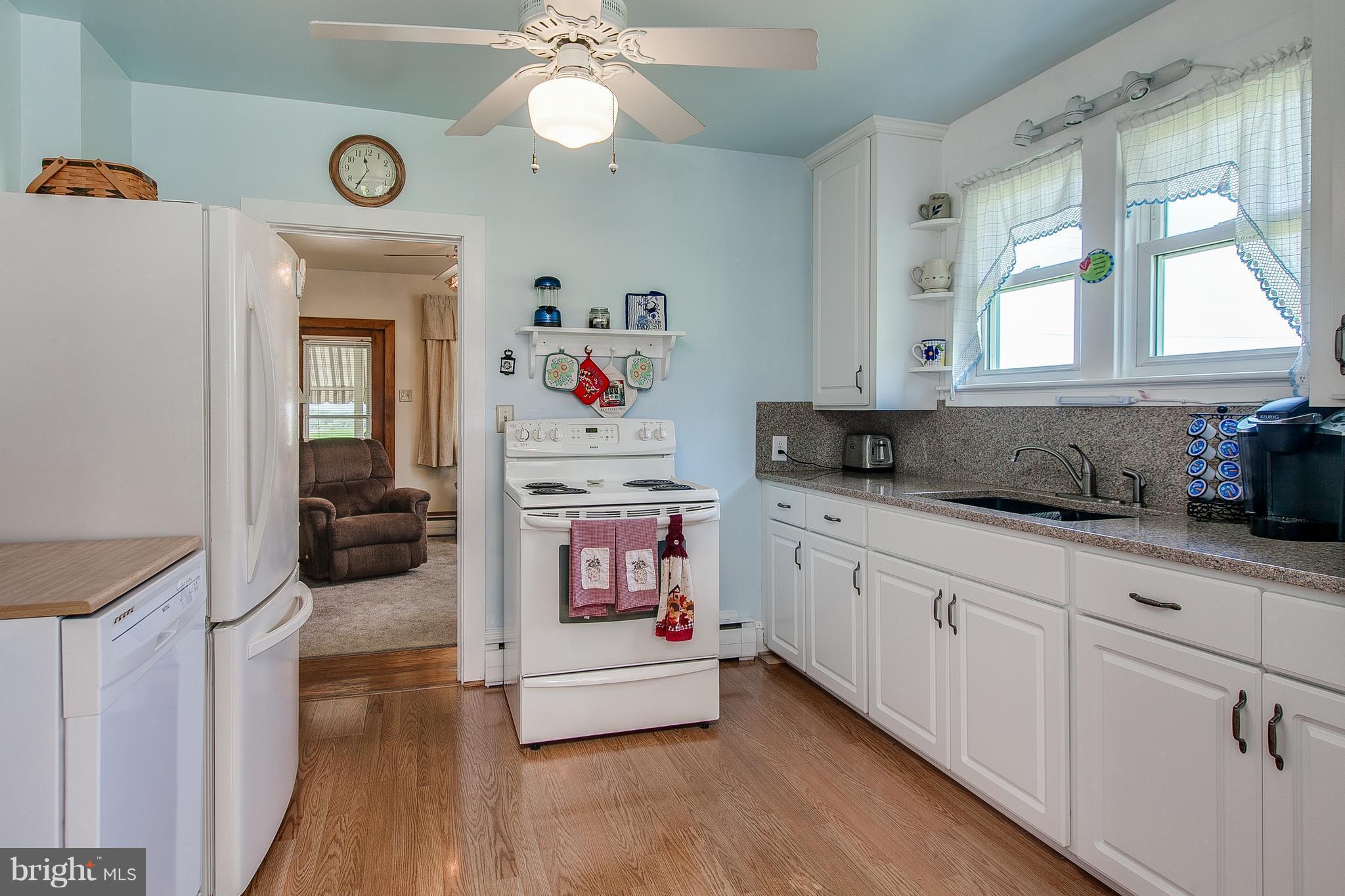 8317 Myersville Road Middletown, MD 21769 - Photo 15 of 30 a kitchen with a refrigerator and a sink