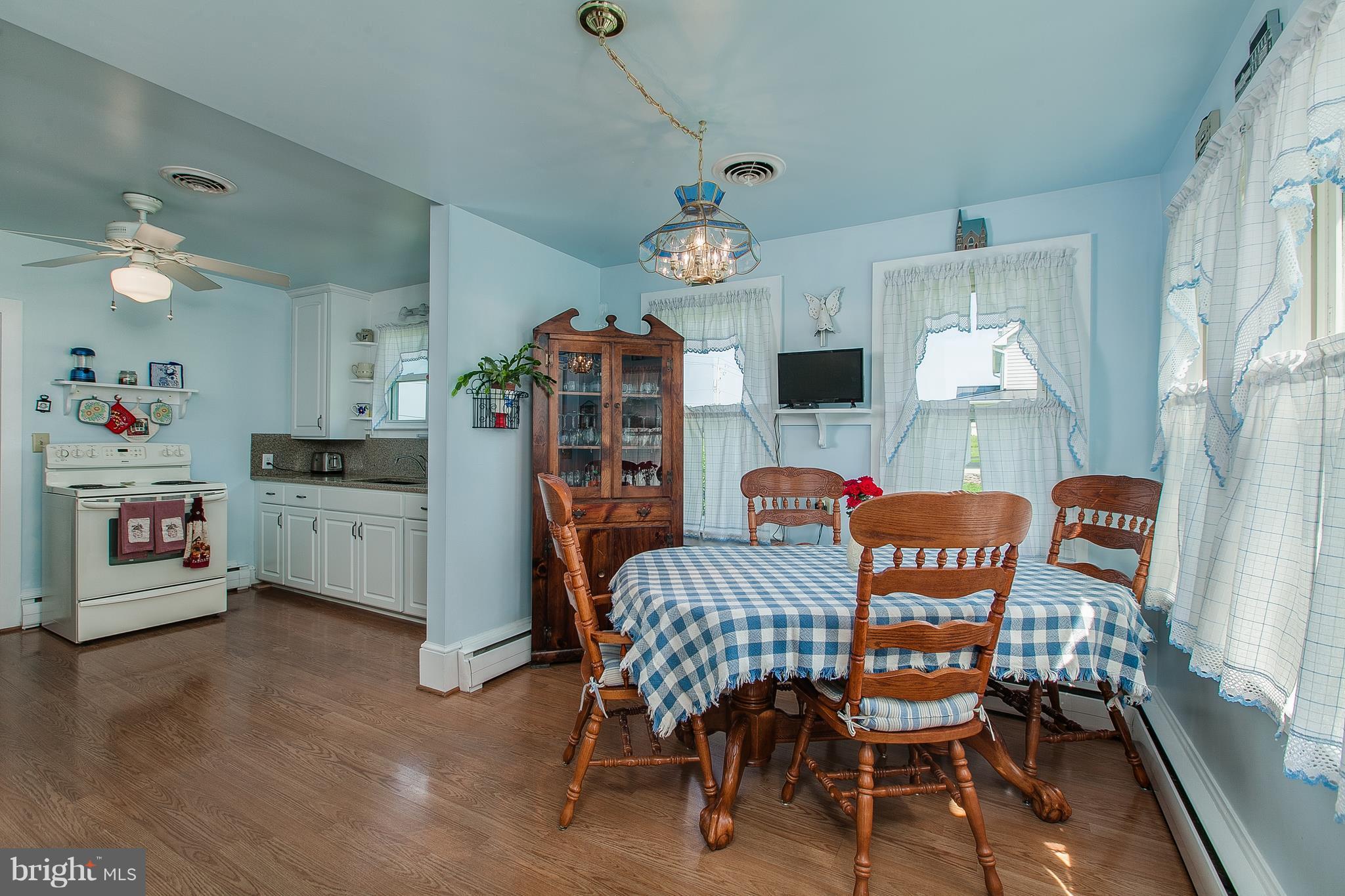 8317 Myersville Road Middletown, MD 21769 - Photo 17 of 30 a view of a dining room with furniture and a chandelier
