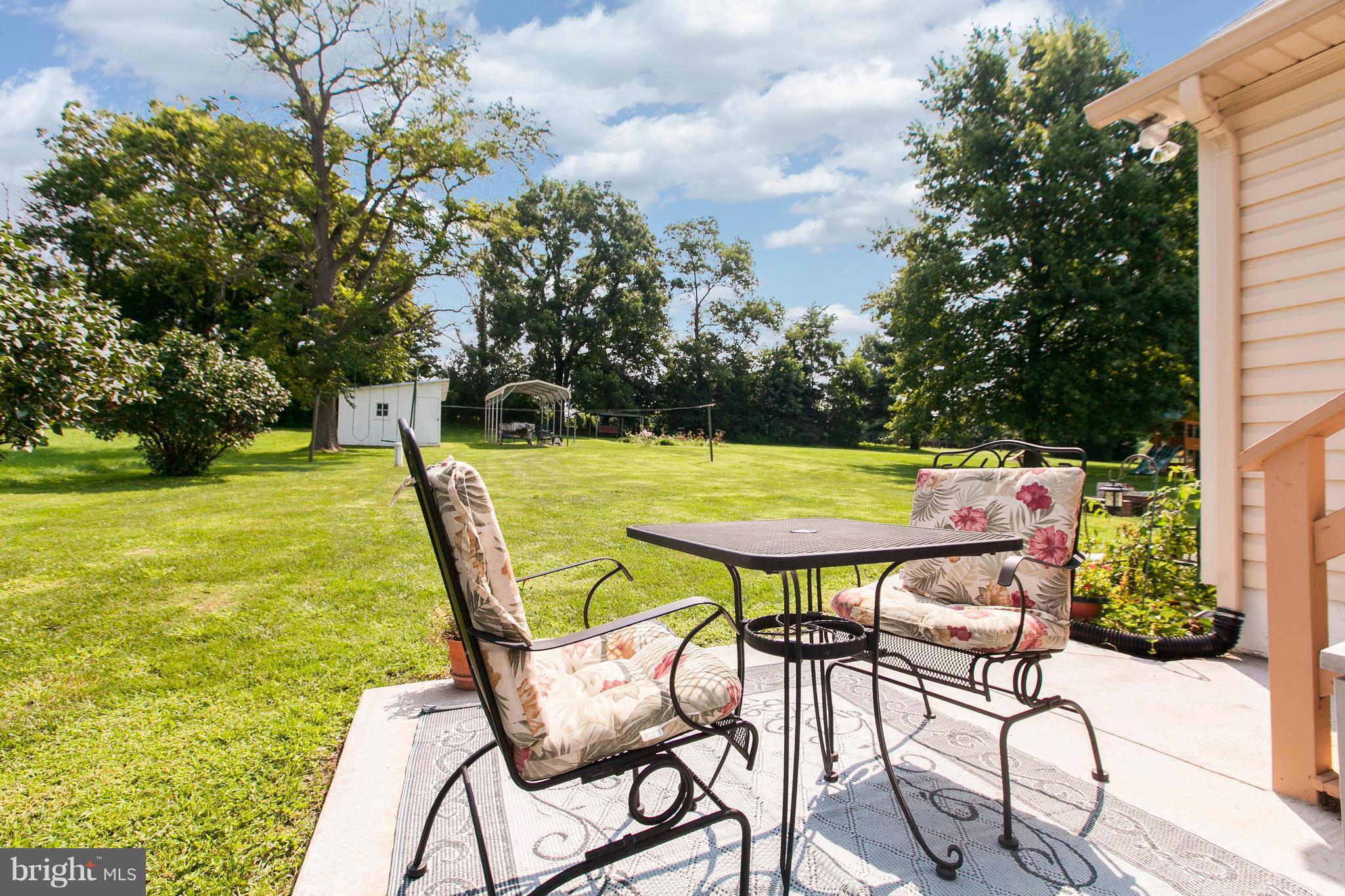 8317 Myersville Road Middletown, MD 21769 - Photo 23 of 30 a view of a swimming pool with chair and table