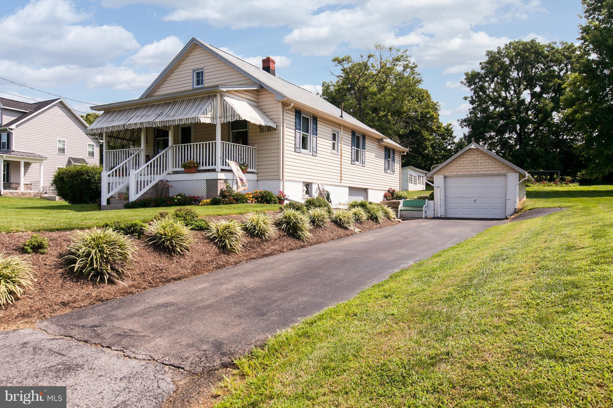 8317 Myersville Road Middletown, MD 21769 - Photo 30 of 30 a front view of a house with a garden and trees