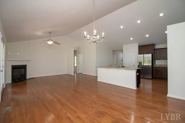 a view of a kitchen with a sink and a large mirror