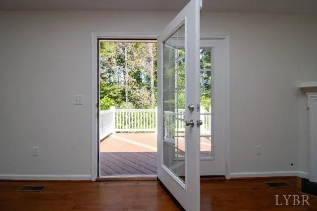 a view of balcony with wooden floor