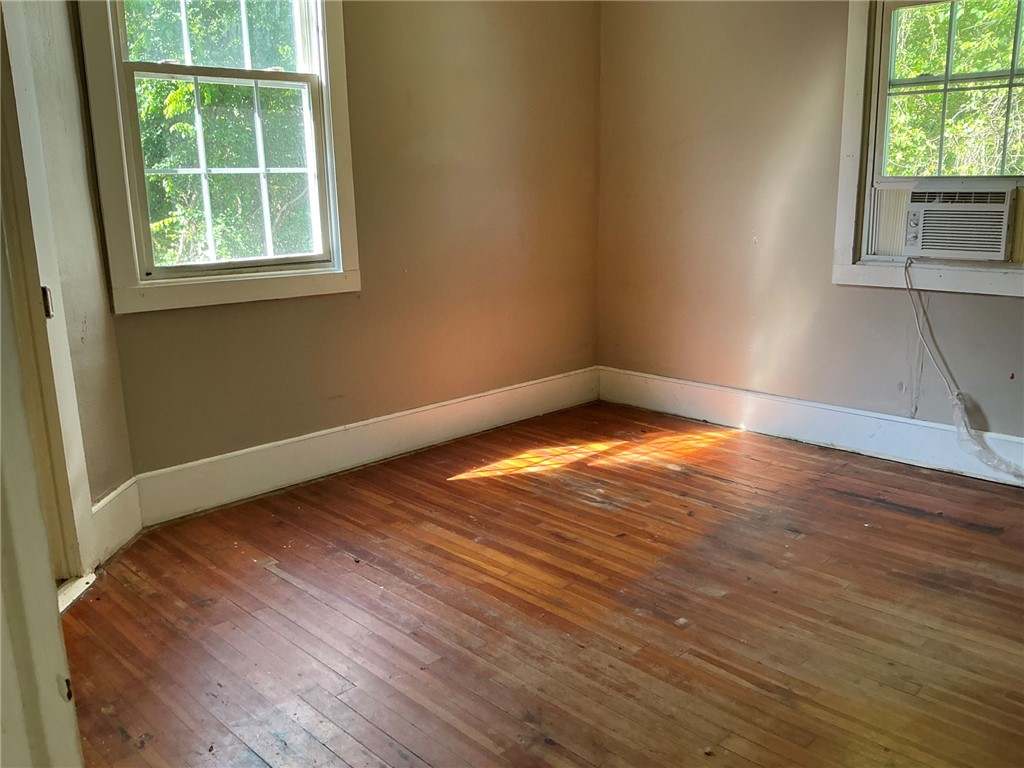 14 Ames Street Seneca, SC 29678 - Photo 12 of 15 This bright room features durable hardwood flooring and ample natural light through its classic windows.