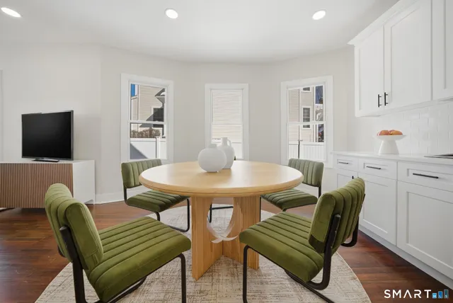 a view of a dining room with furniture
