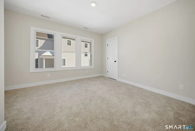 a view of empty room with windows