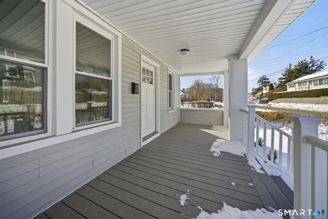 a view of a patio with wooden floor