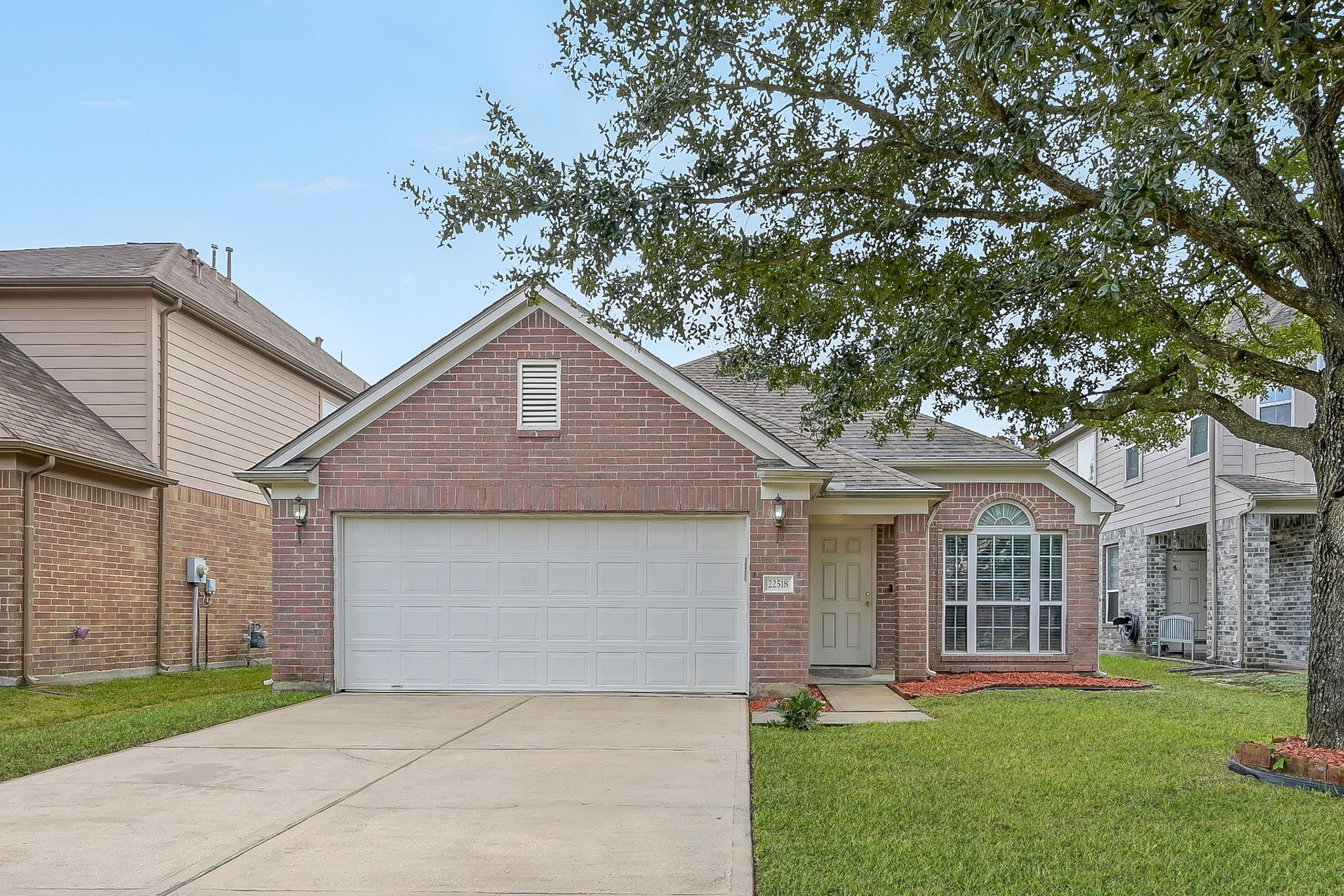 22518 Goss Spring Court Spring, TX 77373 - Photo 1 of 19 Charming single-story brick home with a two-car garage. Features a well-maintained front yard and a welcoming arched window. Perfect for those seeking a cozy, suburban feel.