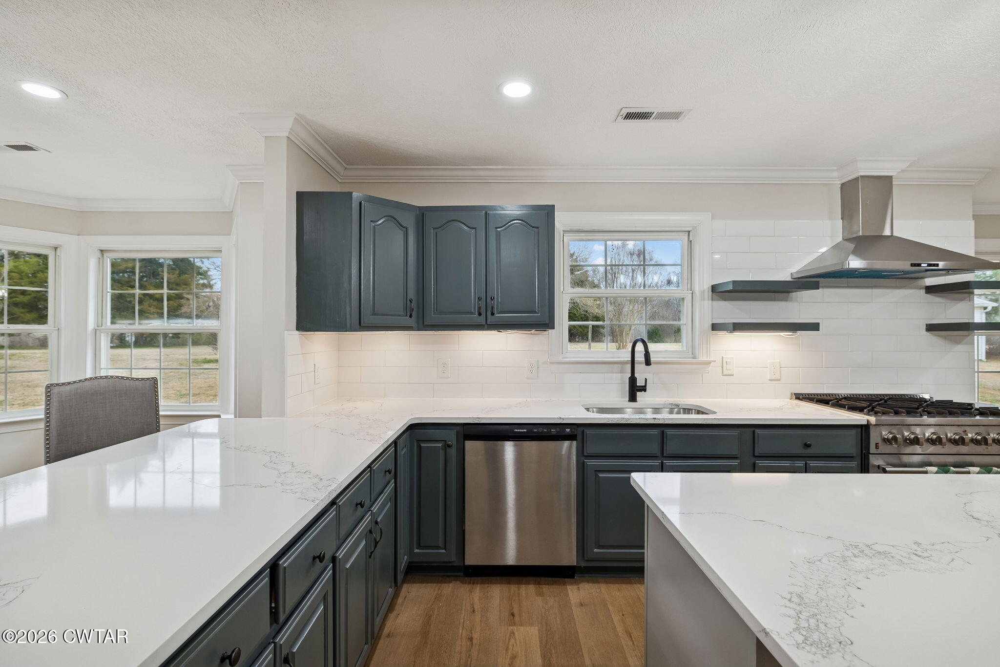 123 Walnut Hill Road Bells, TN 38006 - Photo 18 of 61 a kitchen with stainless steel appliances granite countertop a sink a stove and a wooden floors
