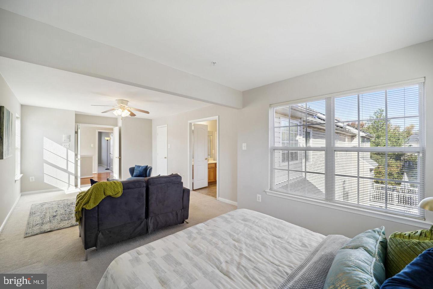 1116 Ring Bill Loop Upper Marlboro, MD 20774 - Photo 14 of 42 a bedroom with a large bed and a large window