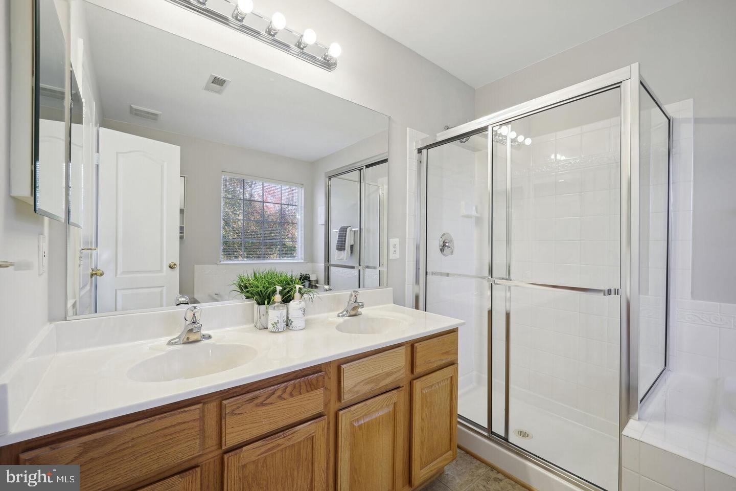 1116 Ring Bill Loop Upper Marlboro, MD 20774 - Photo 16 of 42 a bathroom with a double vanity sink mirror and double